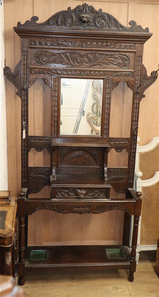 A late Victorian Flemish carved oak hallstand W.134cm